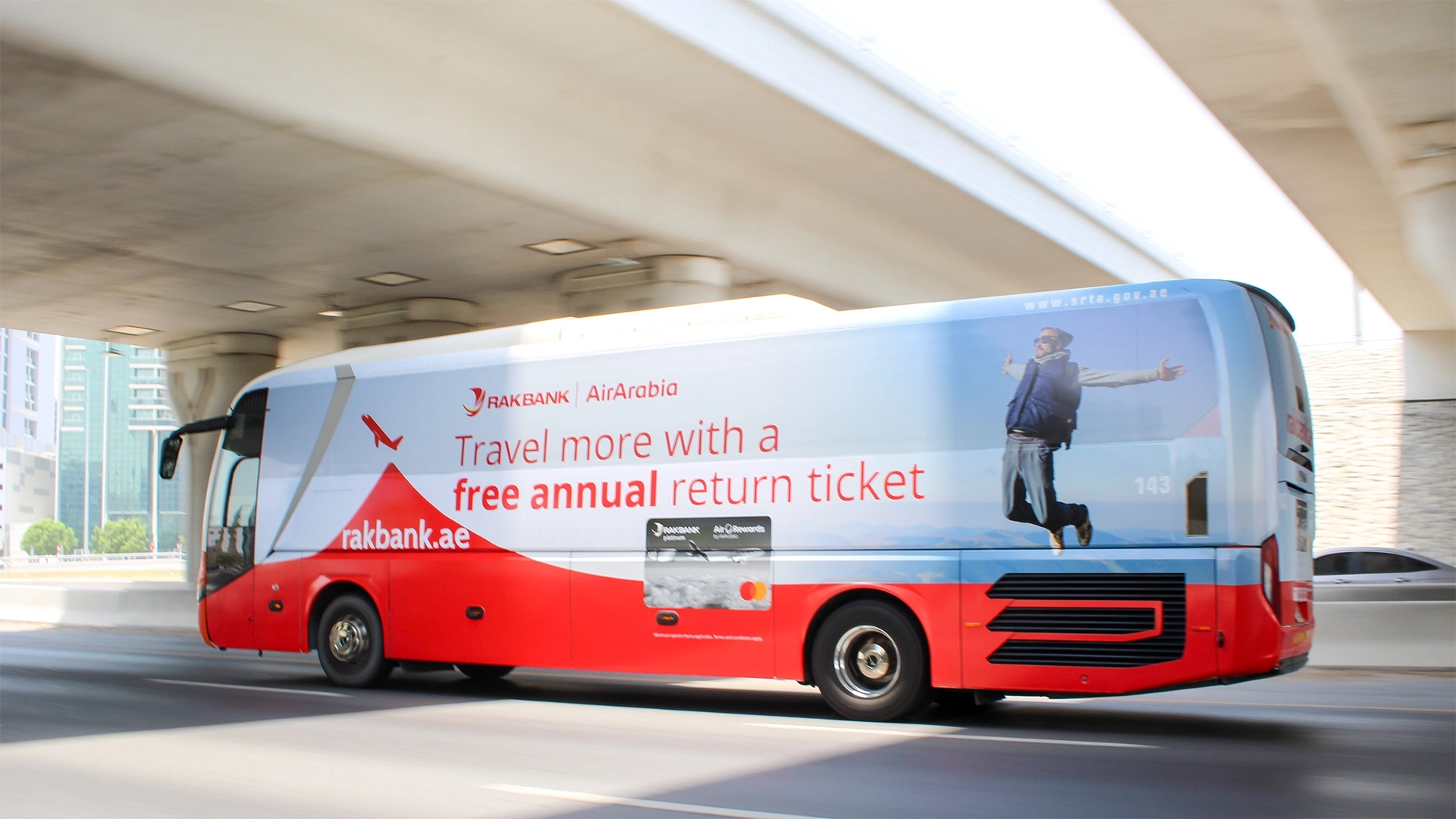 A fully-wrapped bus for RAK Bank travels along Sheikh Zayed Road