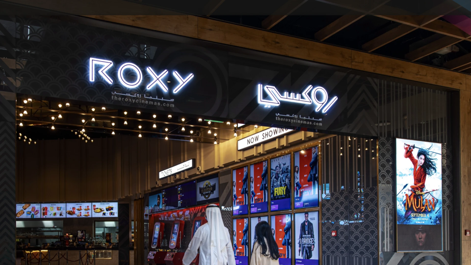 A product sampling booth at a Dubai cinema entrance