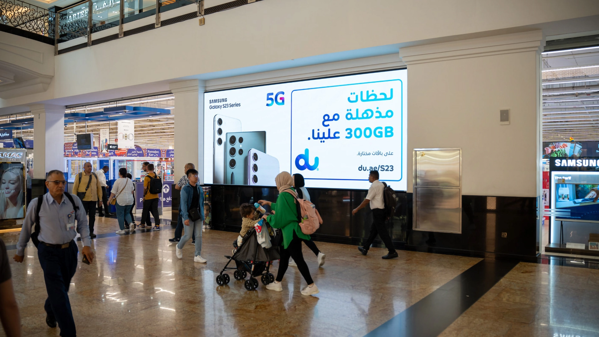 A digital billboard advert for du at The Mall of the Emirates