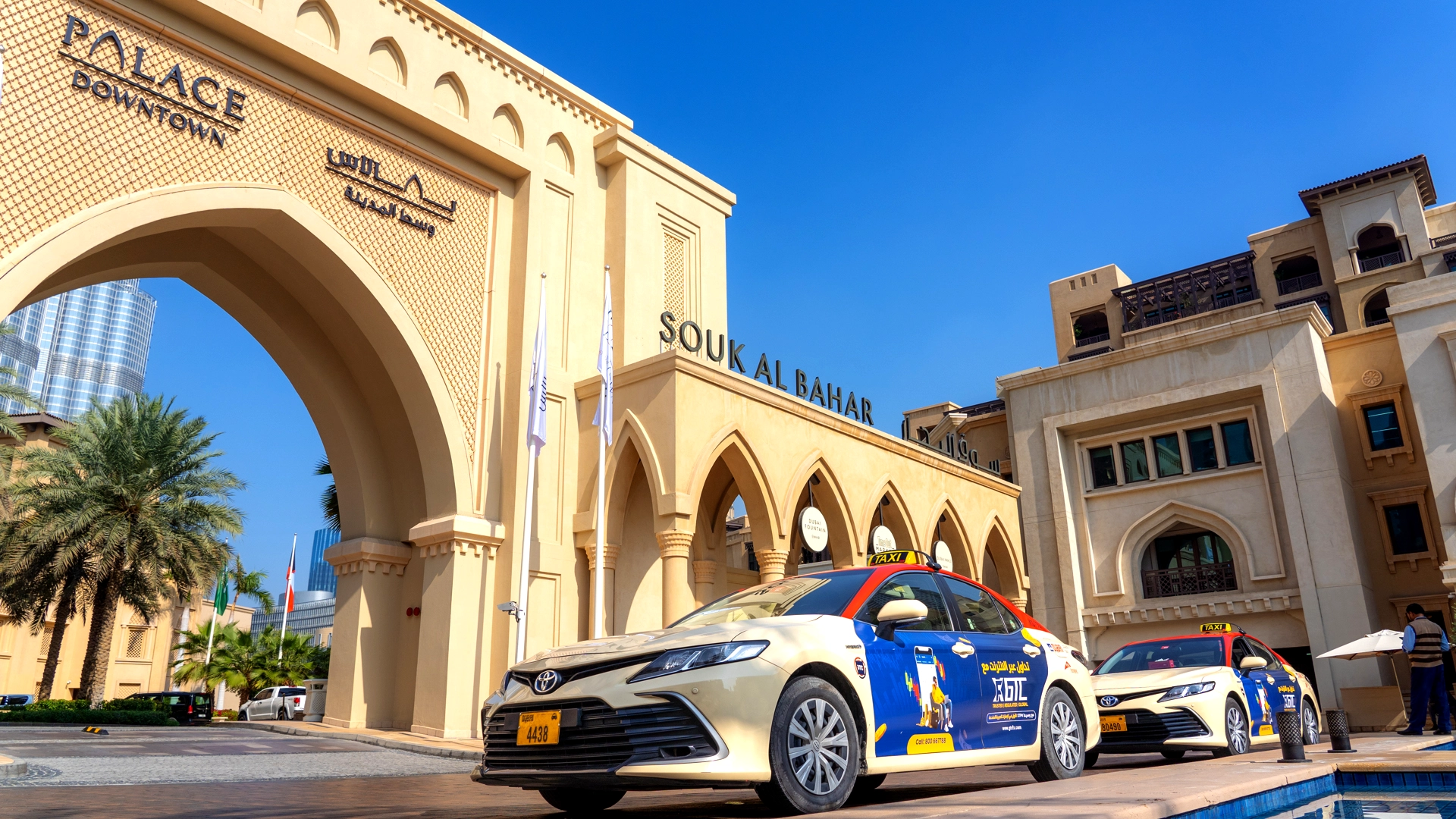 Taxis branded with GTC liveries wait outside the Palace Hotel in Downtown Dubai