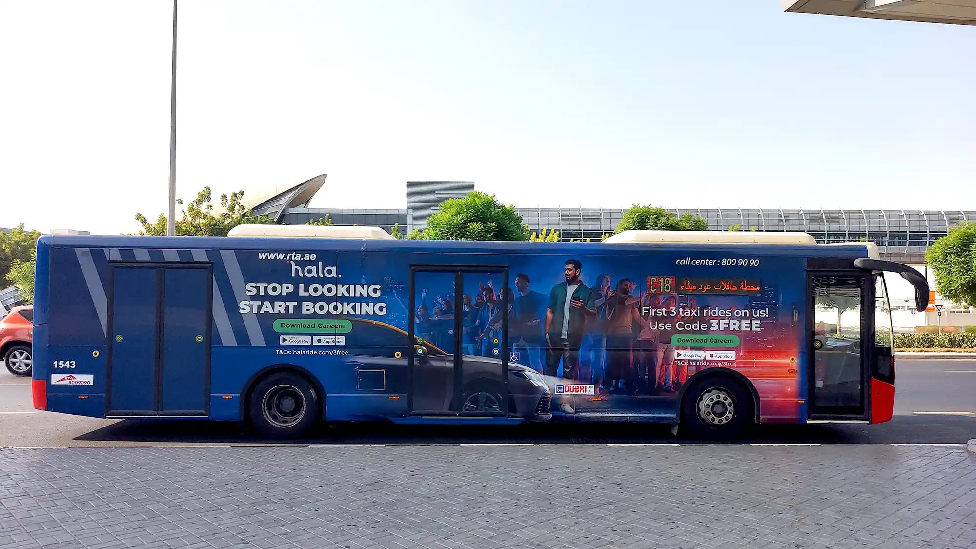 A fully-wrapped bus for RAK Bank travels along Sheikh Zayed Road