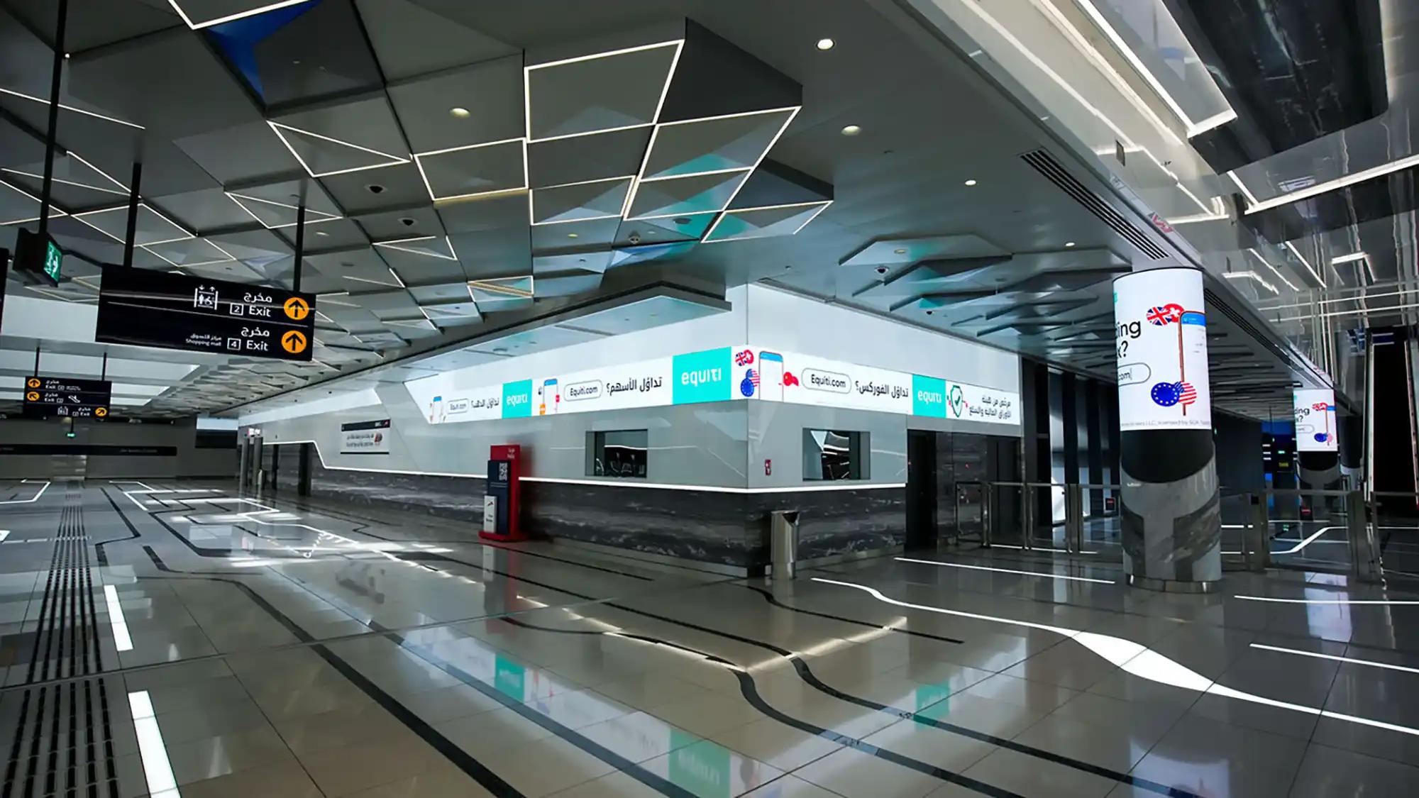 A lift vestibule and complimentary digital screen branded for Centrepoint at a Dubai Metro station