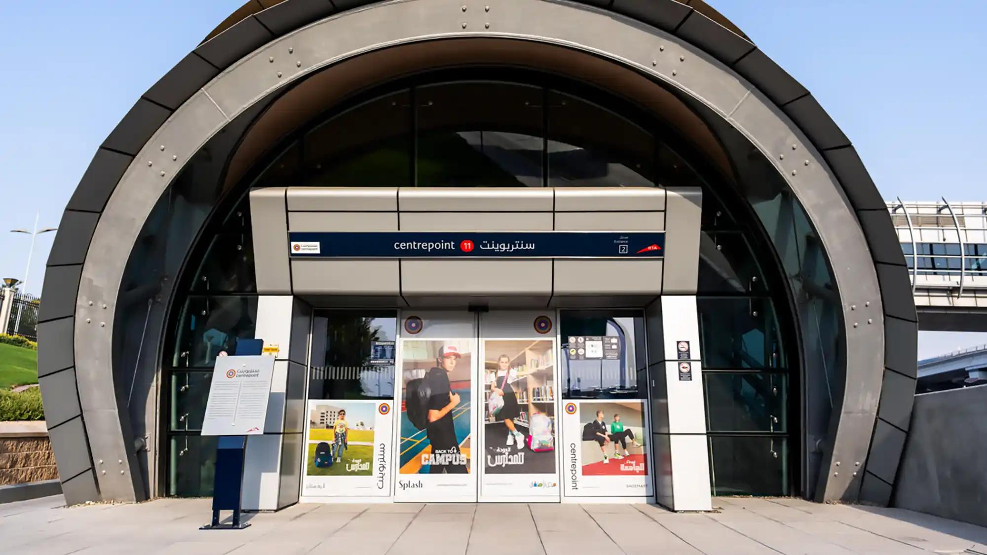 The entrance doors to Dubai Mall metro station branded for Farm Fresh food