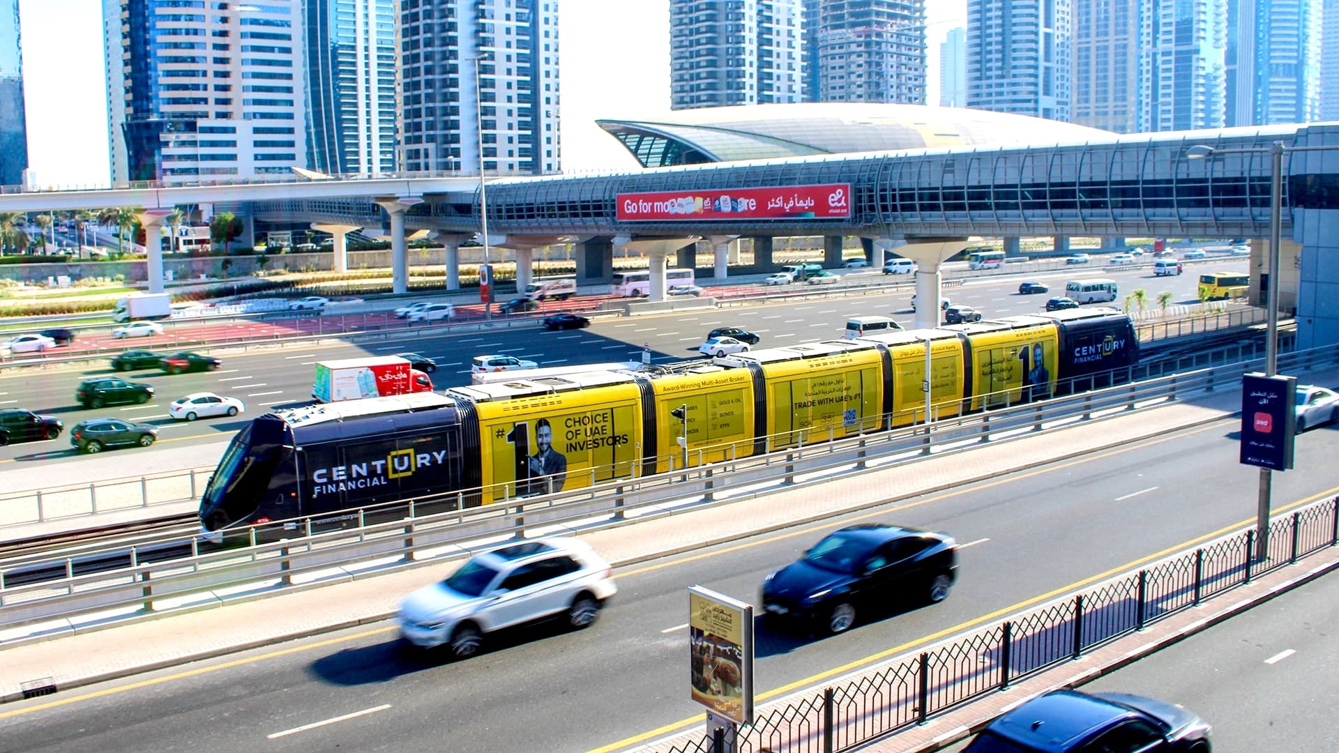 Century Financial tram wrap passing next to Sheikh Zayed Road