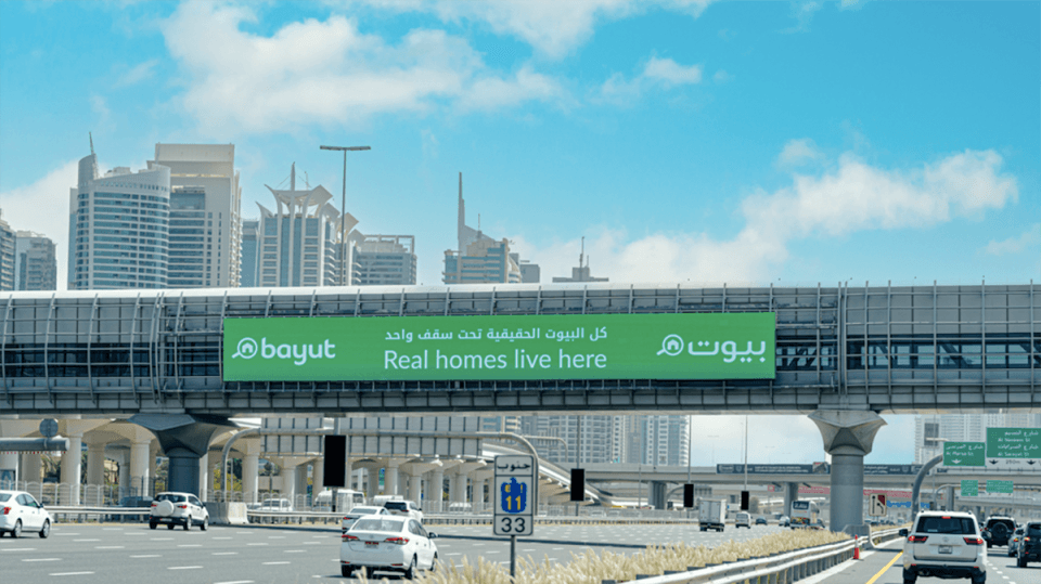 Bridge banner advert on Sheikh Zayed Road featuring a luxury brand