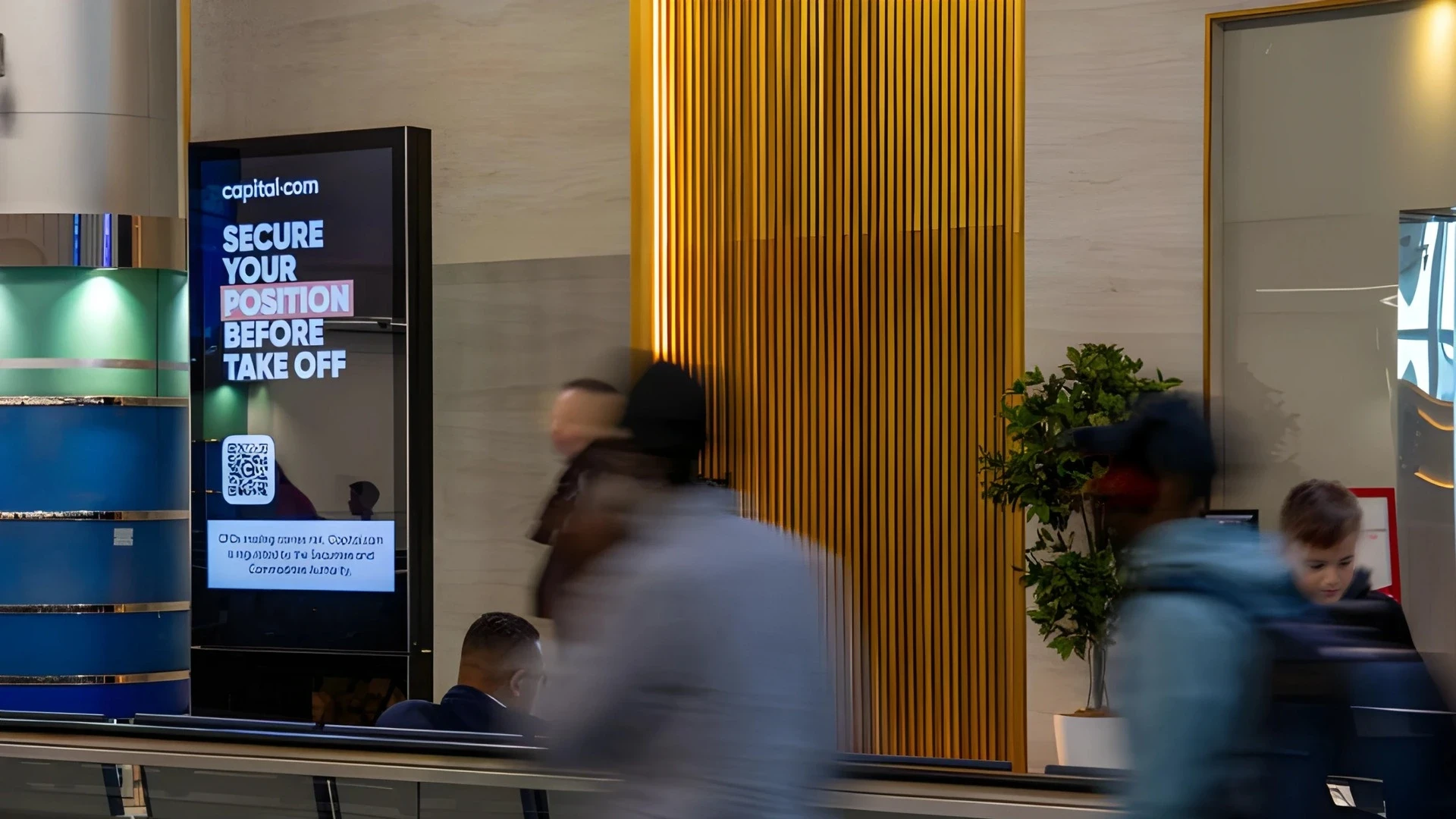 A digital display in a UAE mall showing a programmatic ad rotation
